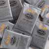 A pile of overwrapped sachets of Lord Bergamot black tea.